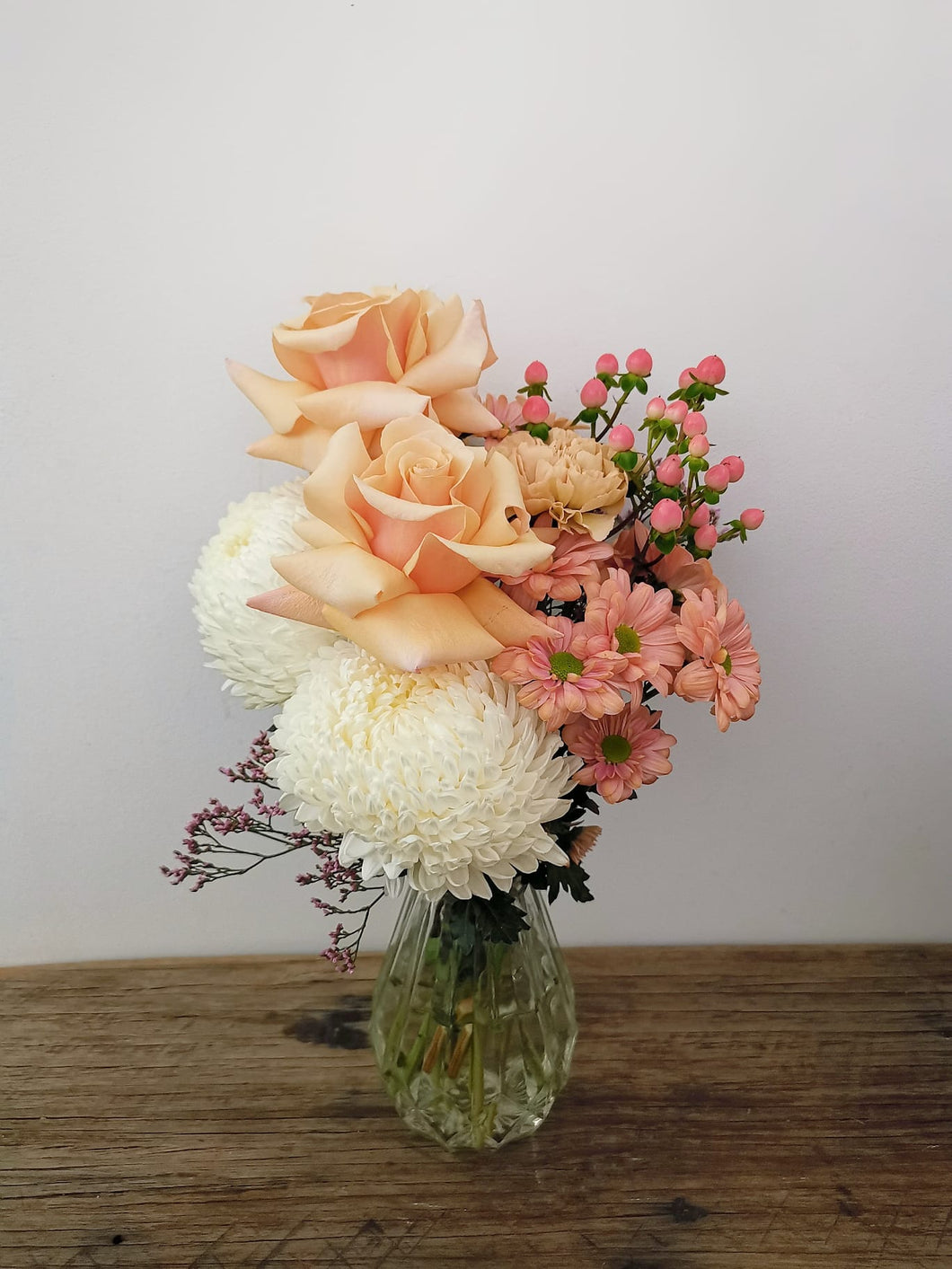 Floral arrangement + glass vase